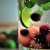 water glass with herbs and fruit