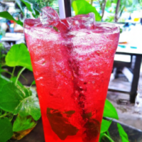 red soda with green leaves