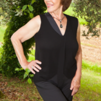 a 60 + year old woman that exhibits health and vitality in a natural setting