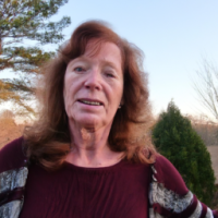 a 60 + year old woman that exhibits health and vitality in a natural setting