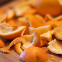 orange peels on a cutting board