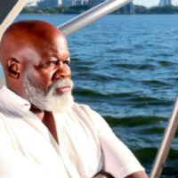 Black Male, 50s, with a beard, on a yacht