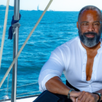 Black Male, 50s, with a beard, on a yacht