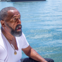Black Male, 50s, with a beard, on a yacht